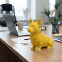 Yellow dog-shaped object on a desk with a blurred office background